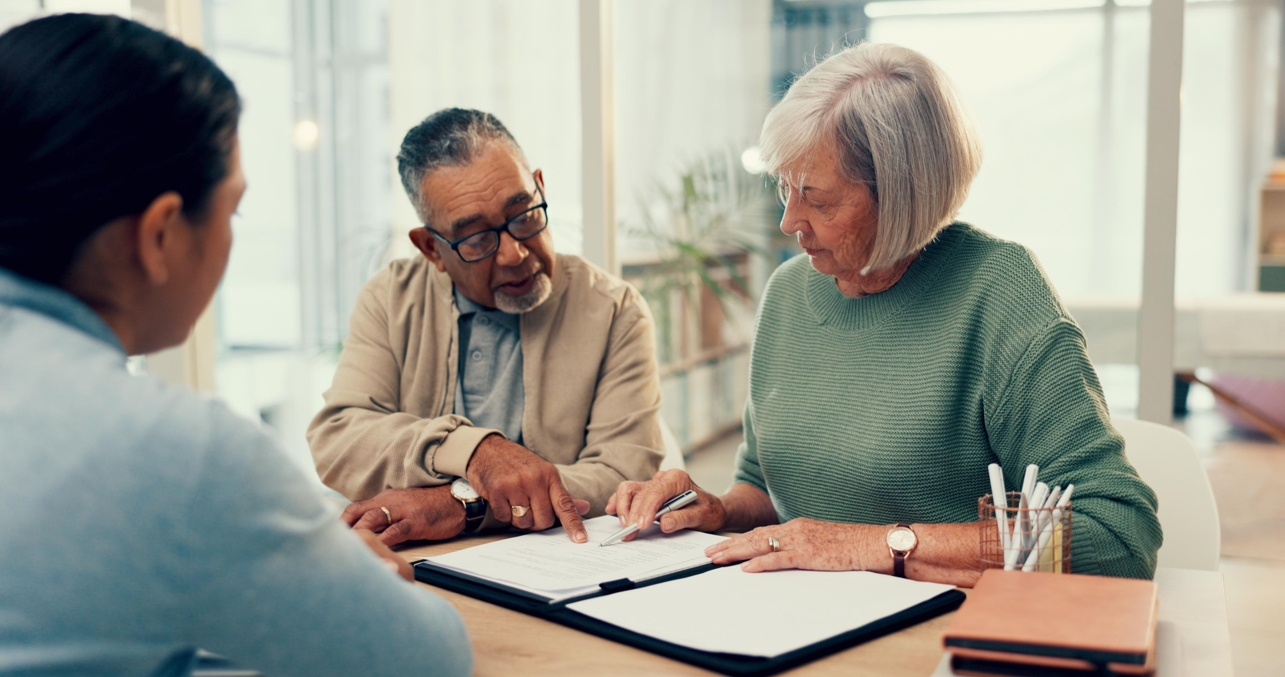 Older couple reviewing insurance papers