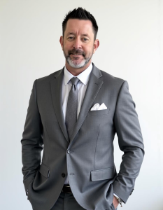 Eric Burg Burg Insurance Wearing a gray suite