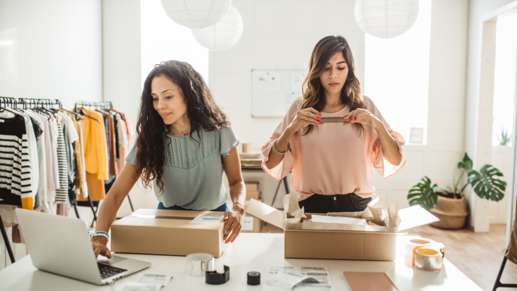 two girls working in a clothing store