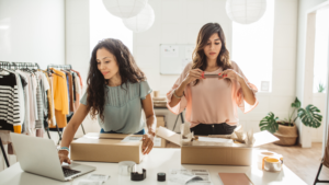 two girls working in a clothing store